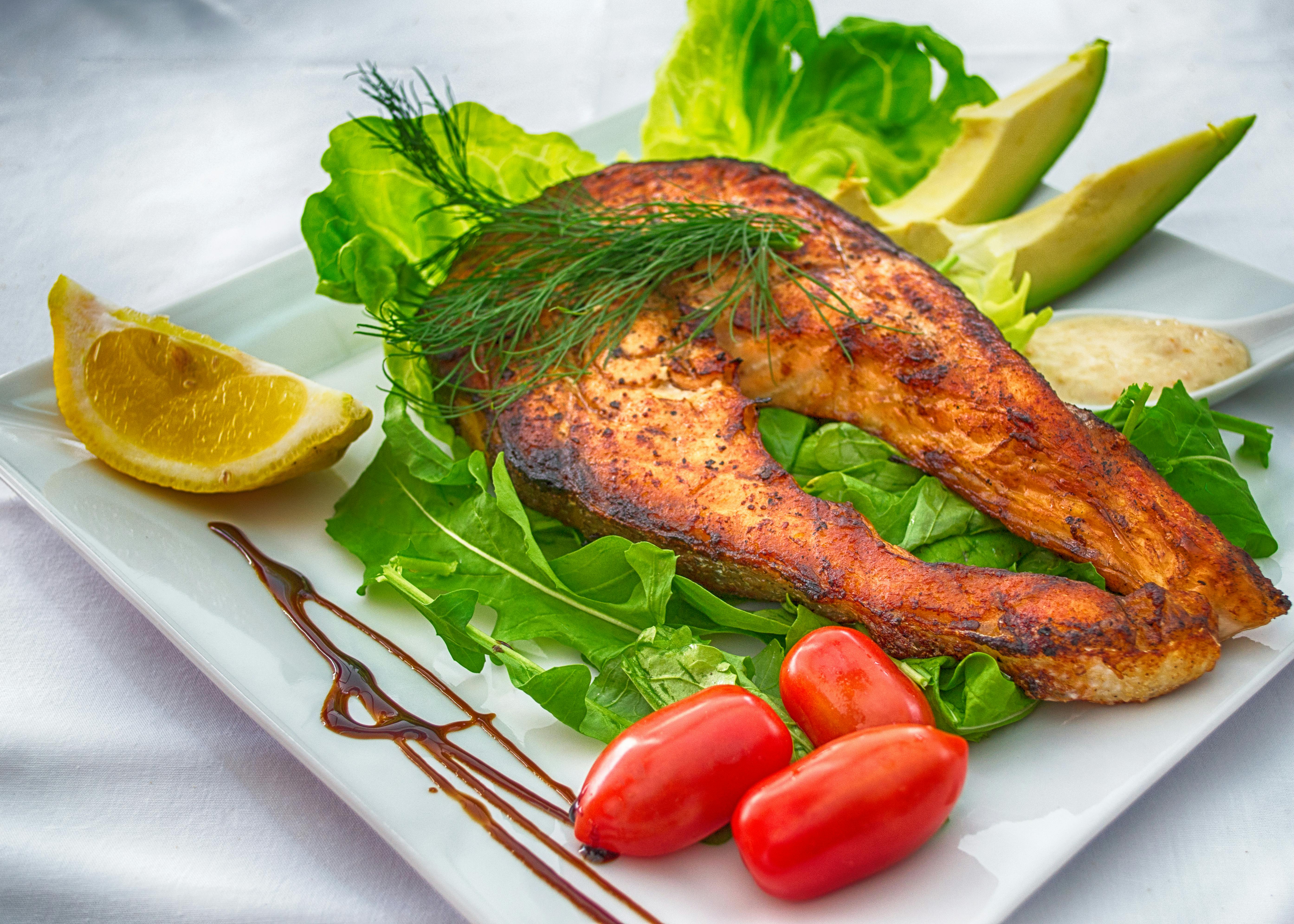 Pan-seared salmon with avocado, lemon, dill and cherry tomatoes