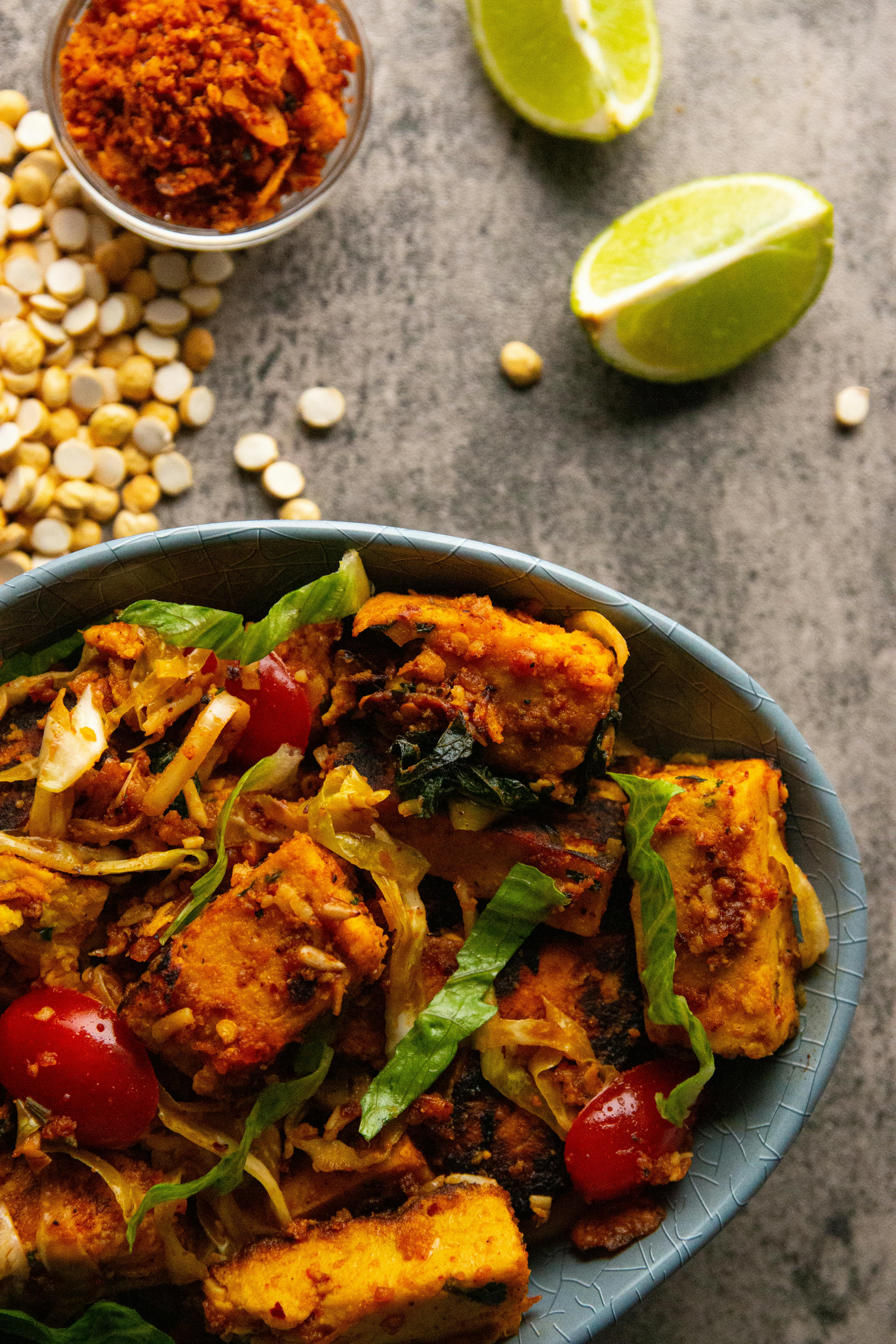 Spiced tofu and vegetable stir-fry with lentils and lime